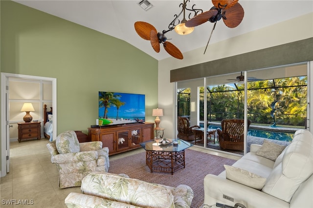 living room with ceiling fan, high vaulted ceiling, and light tile patterned floors