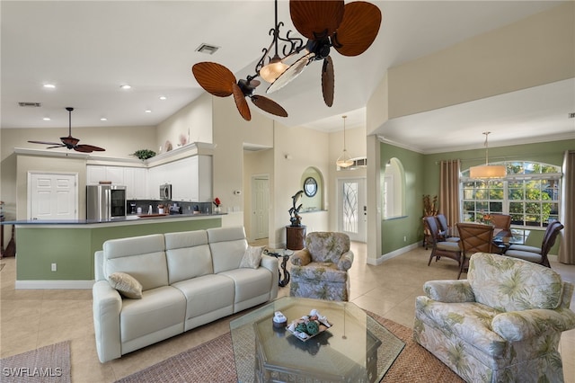 tiled living room featuring crown molding, ceiling fan, and high vaulted ceiling