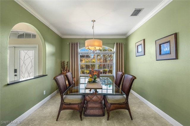 dining area featuring ornamental molding