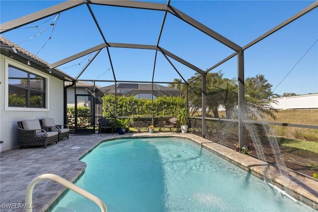 view of pool with pool water feature, an outdoor living space, a patio area, and glass enclosure