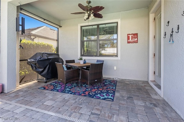 view of patio featuring a grill and ceiling fan