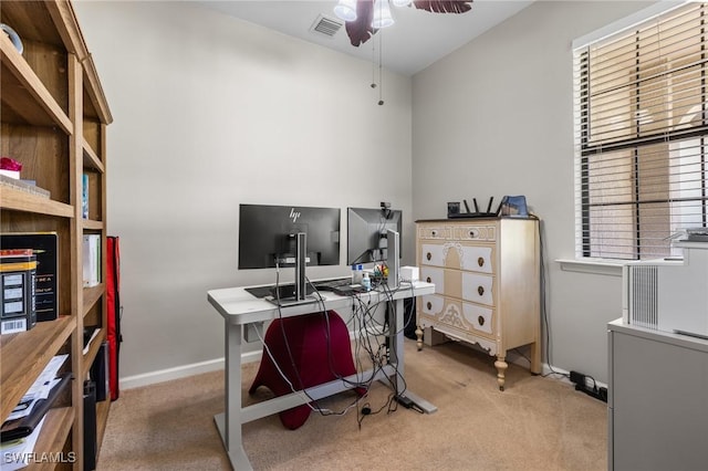 carpeted office space with ceiling fan