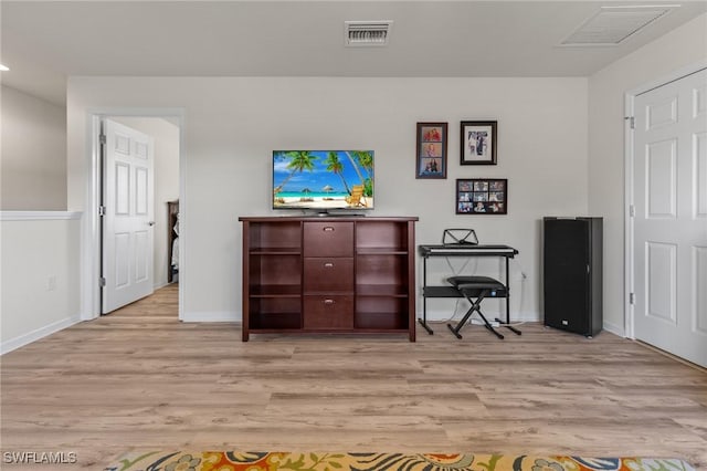 office space with light hardwood / wood-style floors