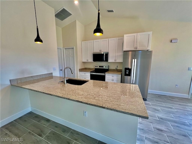 kitchen featuring white cabinetry, pendant lighting, stainless steel appliances, and kitchen peninsula