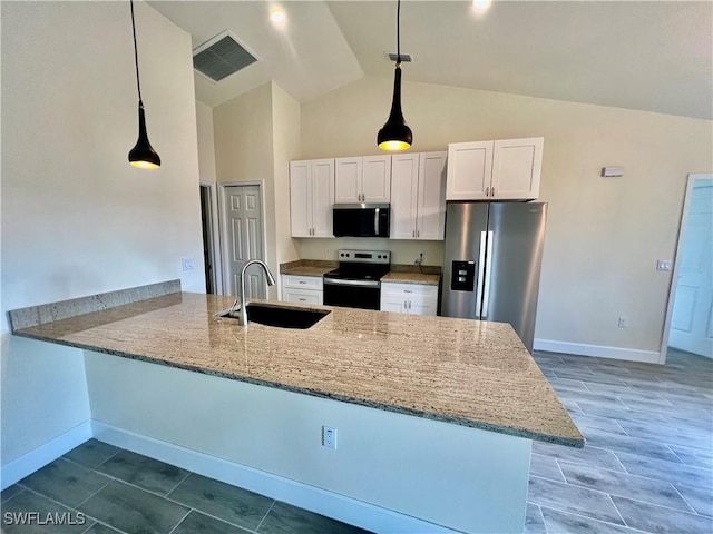 kitchen with sink, white cabinetry, hanging light fixtures, stainless steel appliances, and kitchen peninsula