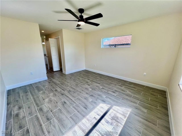 spare room with ceiling fan