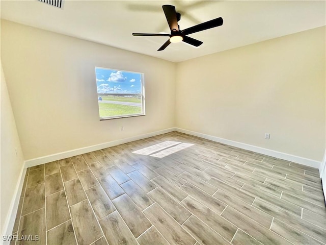 unfurnished room with light hardwood / wood-style flooring and ceiling fan