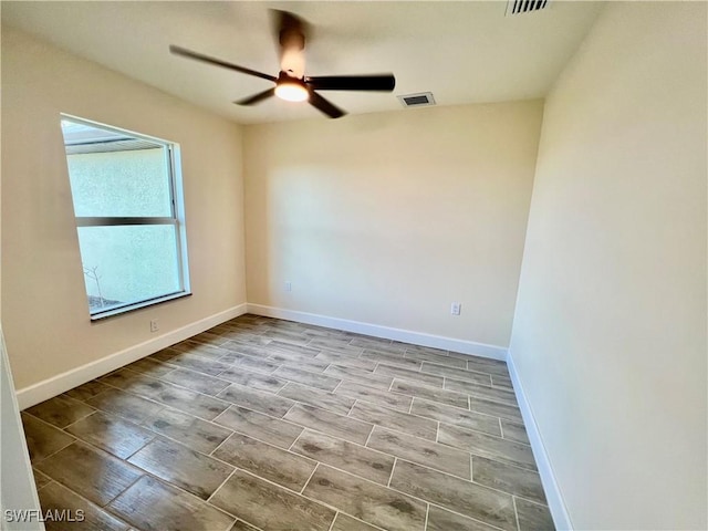 spare room featuring ceiling fan and light wood-type flooring