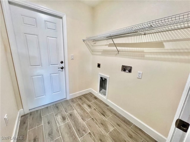 clothes washing area featuring hookup for a washing machine and hookup for an electric dryer