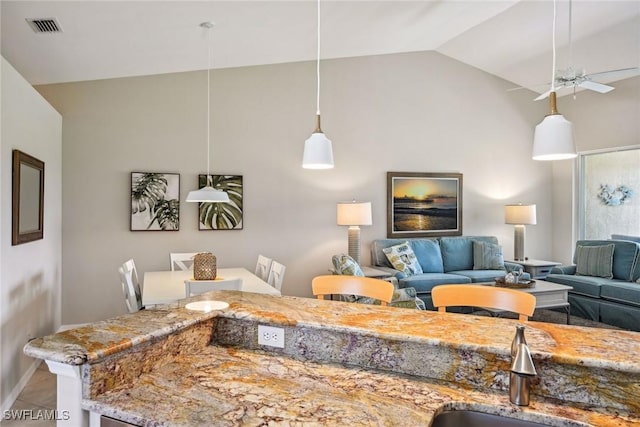 living room with high vaulted ceiling, sink, and ceiling fan