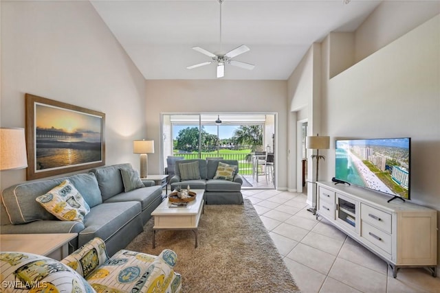 living room with light tile patterned flooring, ceiling fan, and high vaulted ceiling