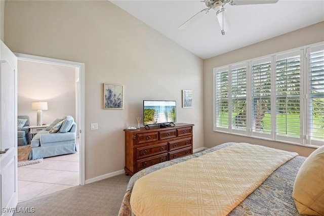 bedroom featuring lofted ceiling, light carpet, and ceiling fan