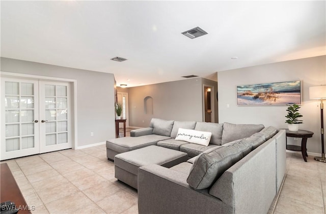 tiled living room with french doors