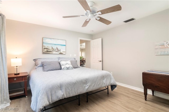 bedroom featuring ceiling fan and light wood-type flooring