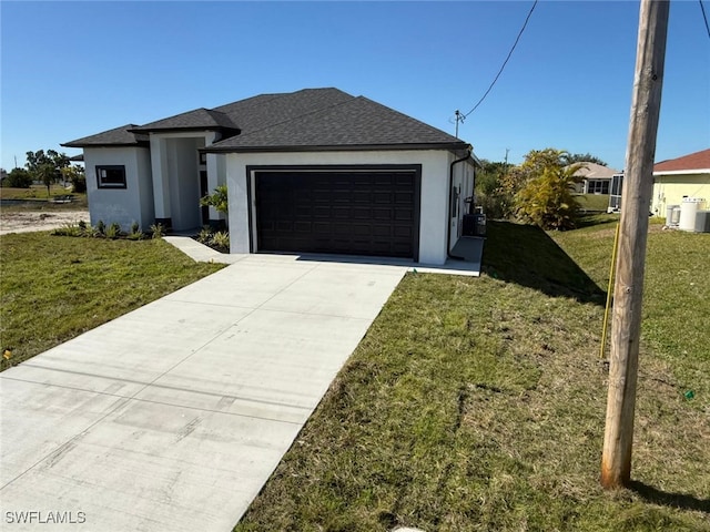 view of front facade with a garage and a front lawn