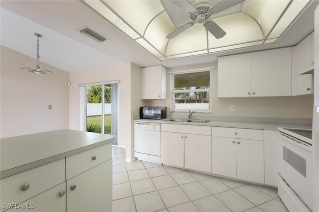 kitchen featuring light tile patterned floors, ceiling fan, white appliances, white cabinets, and sink