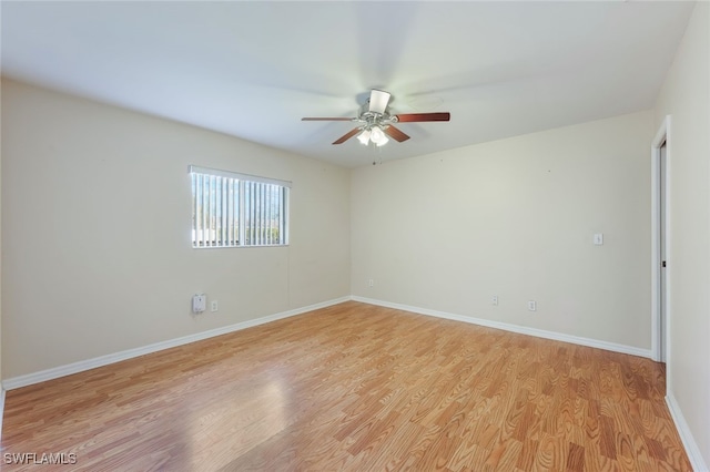 spare room with ceiling fan and light hardwood / wood-style floors