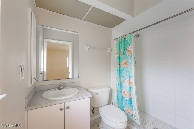 bathroom featuring toilet, a shower with shower curtain, tile patterned flooring, and vanity