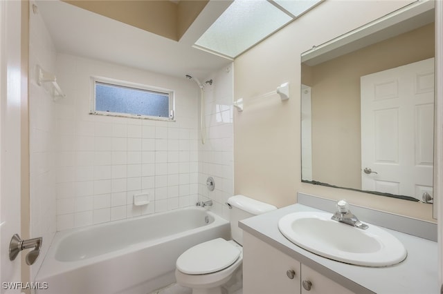 full bathroom with toilet, tiled shower / bath, and vanity