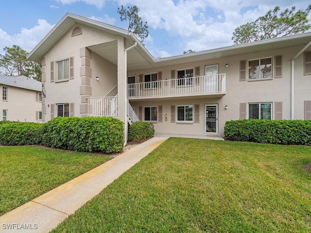 view of front of property with a front lawn