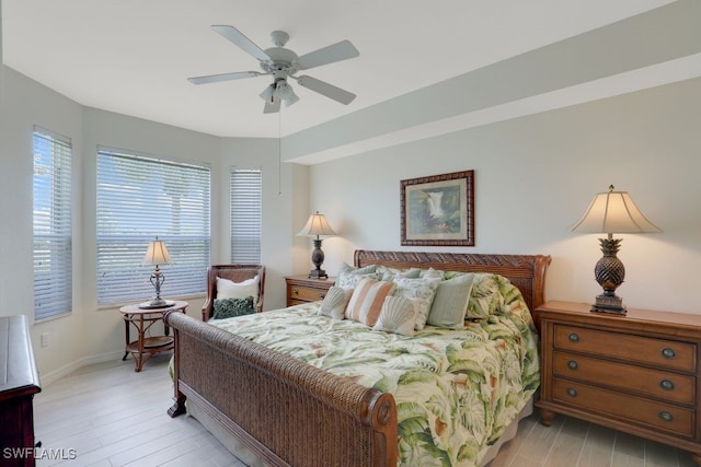 bedroom with ceiling fan and light hardwood / wood-style flooring