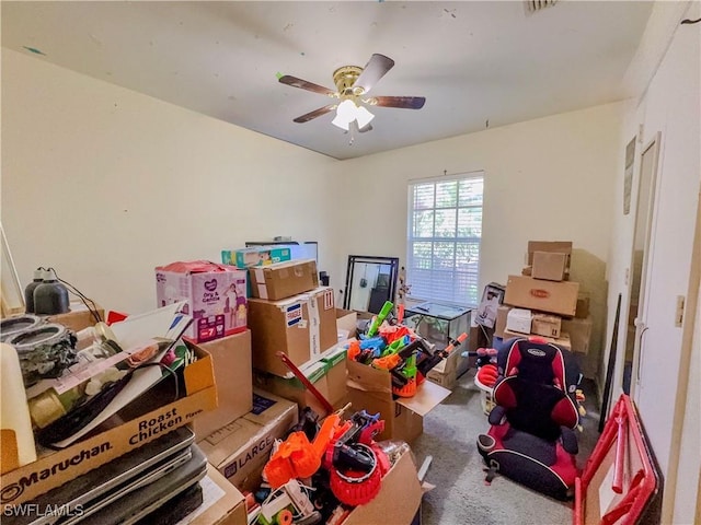 interior space with ceiling fan