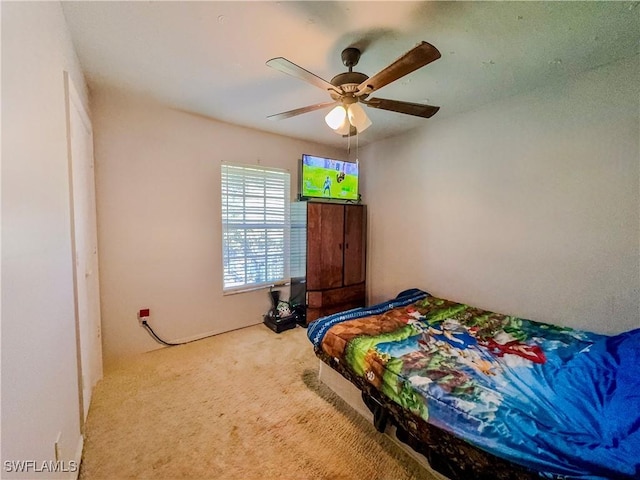 bedroom with ceiling fan and carpet flooring