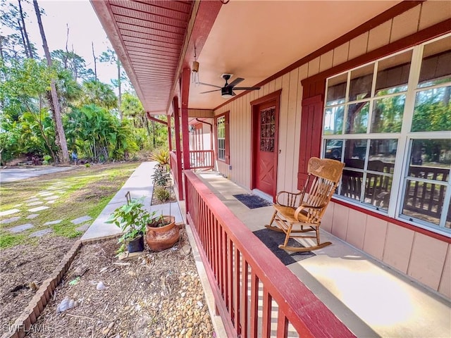 view of patio featuring ceiling fan and a porch