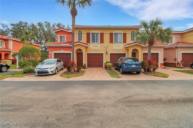 mediterranean / spanish-style home featuring a garage