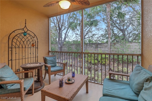 sunroom with ceiling fan and a healthy amount of sunlight