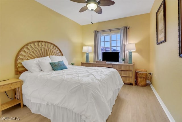 bedroom with ceiling fan and light hardwood / wood-style flooring