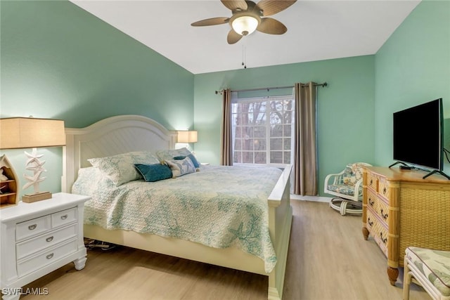 bedroom with ceiling fan and light wood-type flooring