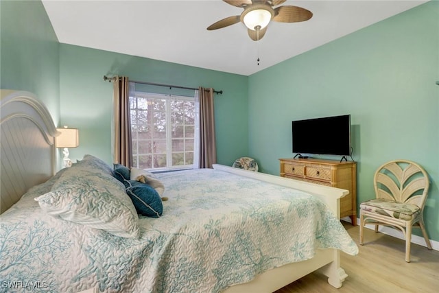 bedroom with ceiling fan and light hardwood / wood-style floors