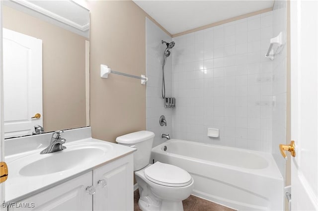 full bathroom featuring tile patterned floors, vanity, toilet, and tiled shower / bath combo