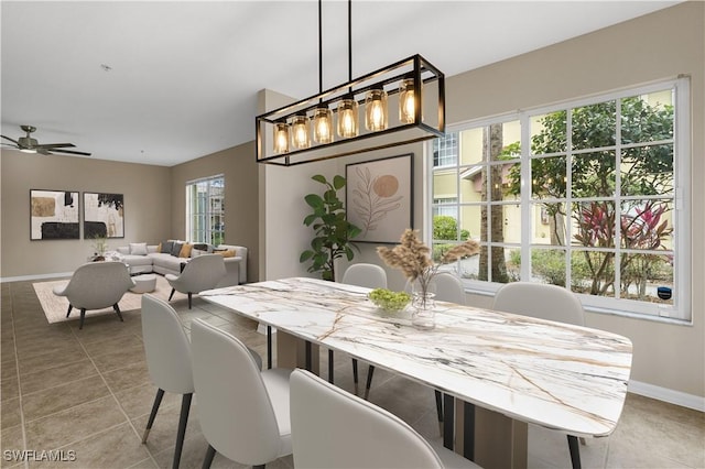 tiled dining room with ceiling fan