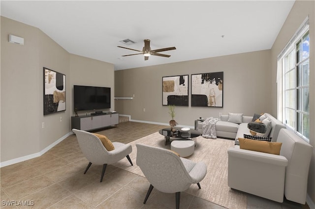 living room with ceiling fan and light tile patterned floors