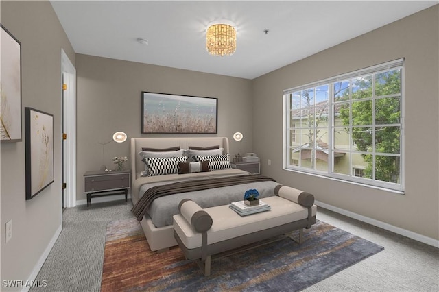 bedroom with dark colored carpet