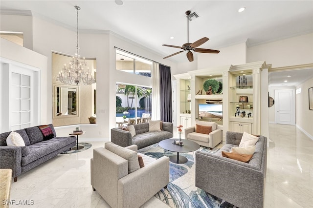 living room with ornamental molding, a towering ceiling, ceiling fan with notable chandelier, and built in features