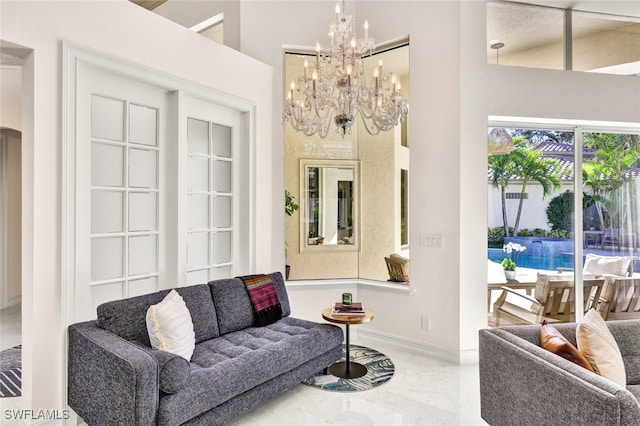 living room with a notable chandelier