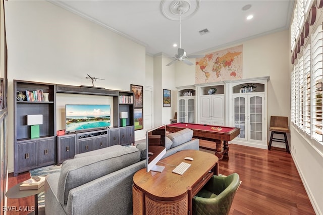 interior space featuring dark hardwood / wood-style flooring, pool table, ornamental molding, and french doors