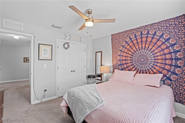 bedroom with baseboards, visible vents, and light colored carpet