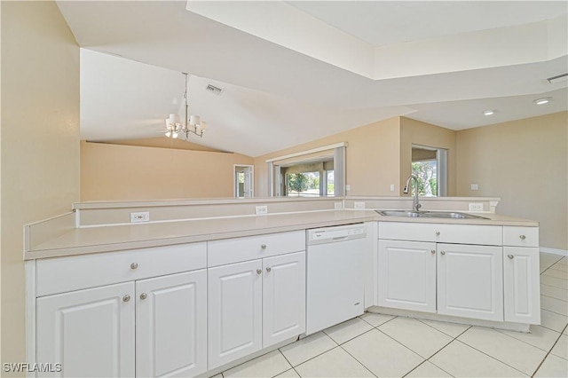 kitchen featuring white cabinetry, dishwasher, lofted ceiling, sink, and light tile patterned floors