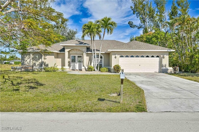 single story home featuring a garage, a front yard, and french doors