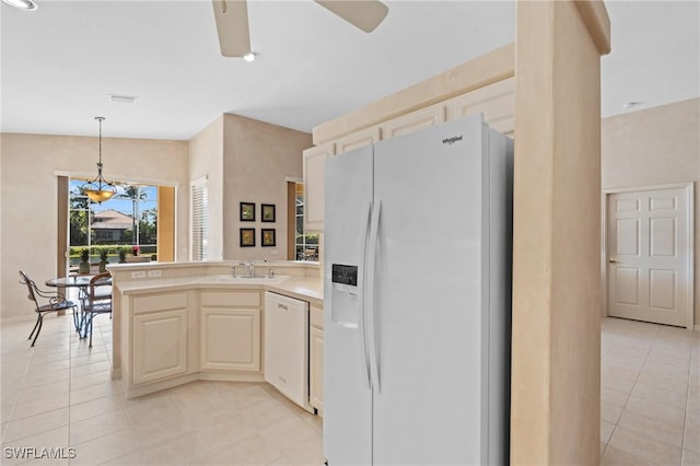 kitchen with sink, hanging light fixtures, light tile patterned floors, kitchen peninsula, and white appliances