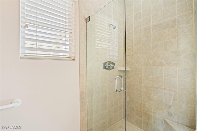 bathroom featuring an enclosed shower