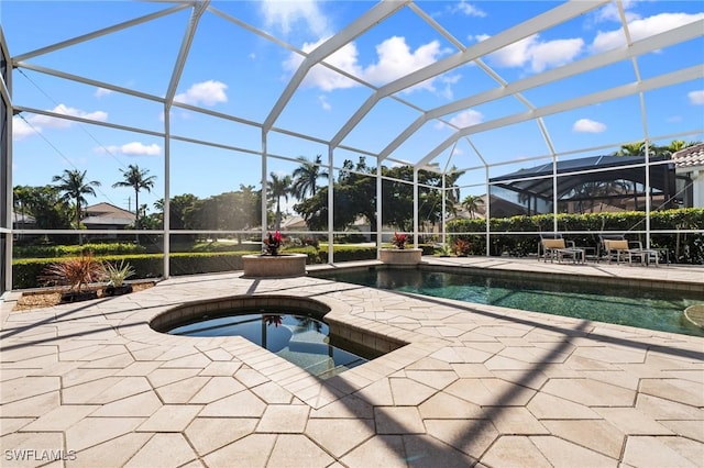 view of swimming pool with a lanai, a patio, and an in ground hot tub