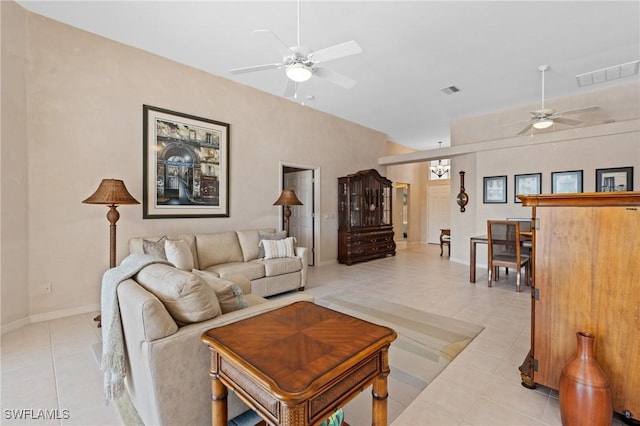 tiled living room with ceiling fan