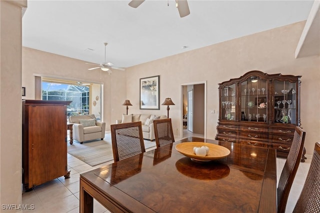 dining room featuring light tile patterned flooring and ceiling fan