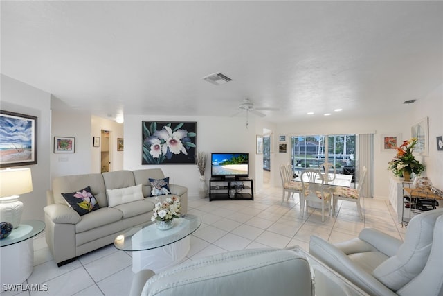 tiled living room with ceiling fan