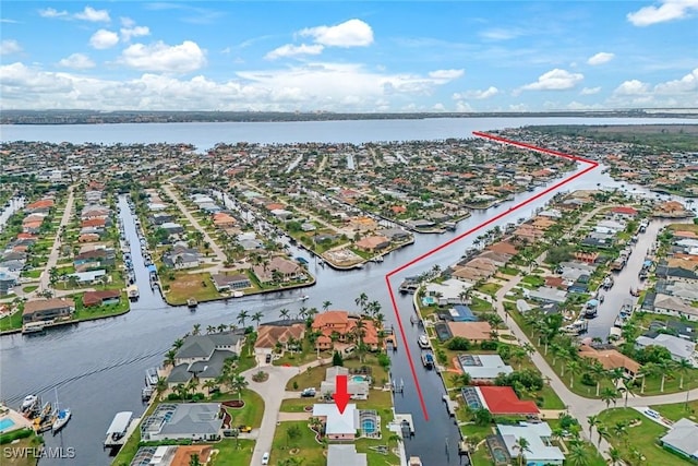 birds eye view of property featuring a water view